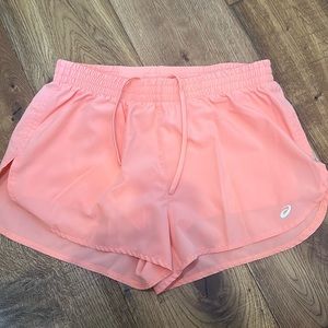 Light pink Asics athletic shorts with spandex liner